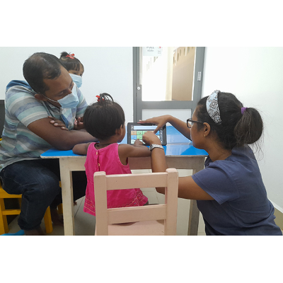 Clinicians work with a child at Atayi Clinic