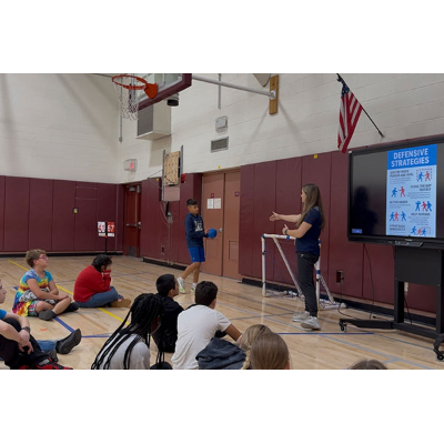 Student teaching team handball defensive strategies to sixth graders at Unionville (N.Y.) Middle School