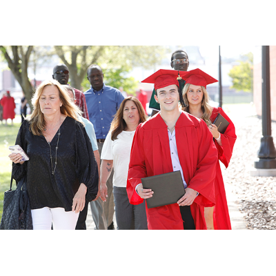 Jubilant family members rejoin their graduate outside Park Center