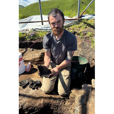 William Kennedy displays pottery found at Alaska site.
