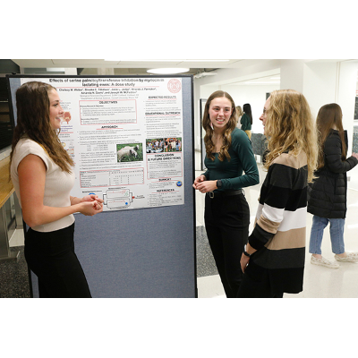 Brooke Tillotson, center, discusses research