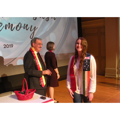 Student receiving UK and Ireland sash