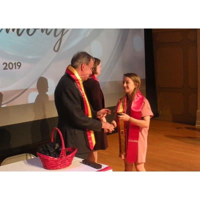 Student receiving Spanish sash