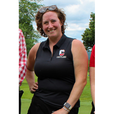 Cali Young '09 relaxes with her co-workers over a golf game.