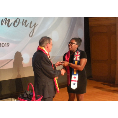 Student receiving Barbados sash
