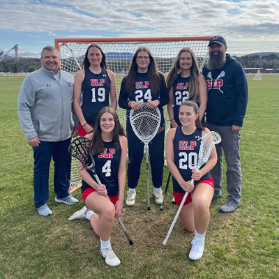 Coach Dann with senior women on the 2024 Saranac Lake/Lake Placid varsity lacrosse team
