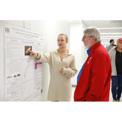 Symposium sponsor Michael Bond, M.D., right