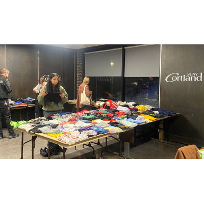 Students looking at the Items laid out for the SCRA Eco-Swap event.