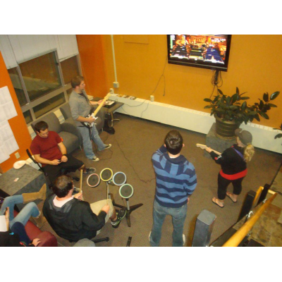 Students playing Rock Band in Alger Hall