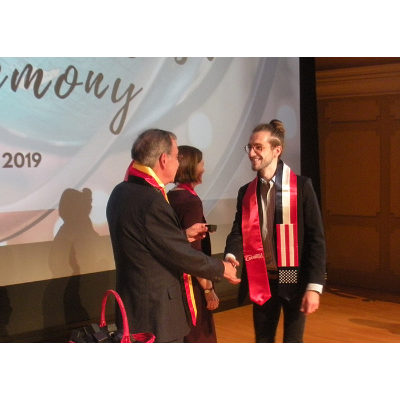 Student receiving French sash