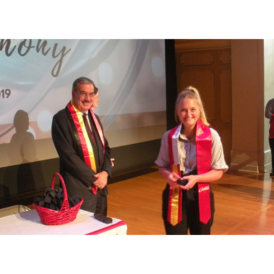 Student receiving Polish sash