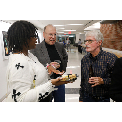 Symposium sponsor William Baerthlein, M.D., center