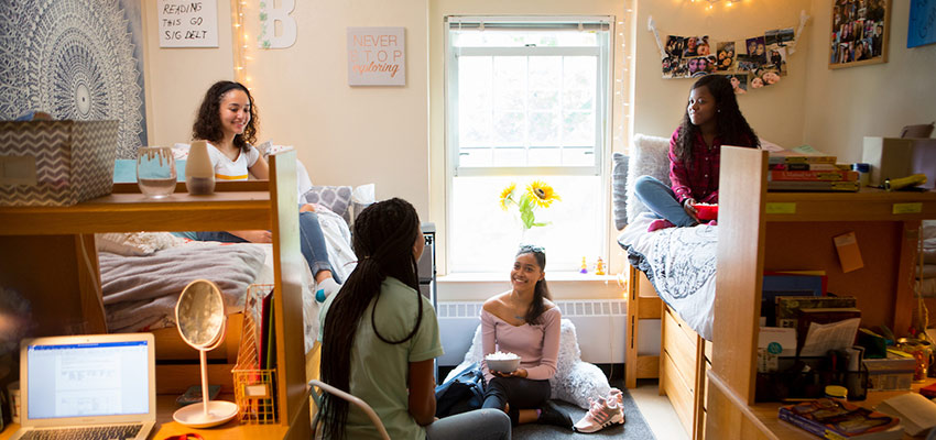 Students hanging in a residence hall room