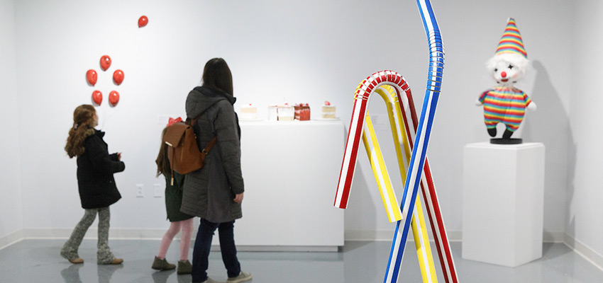 Mom and children look at colorful Dowd Gallery art exhibit