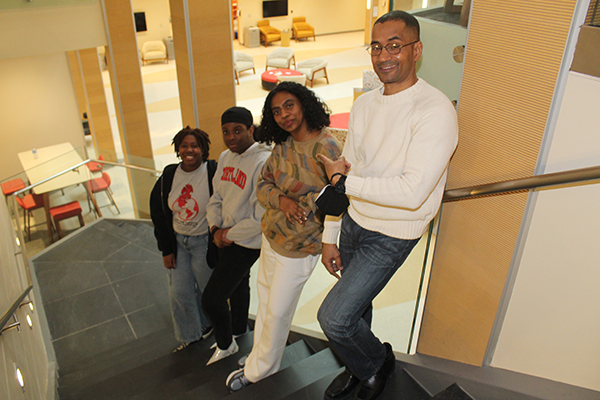 Tillotson with three students