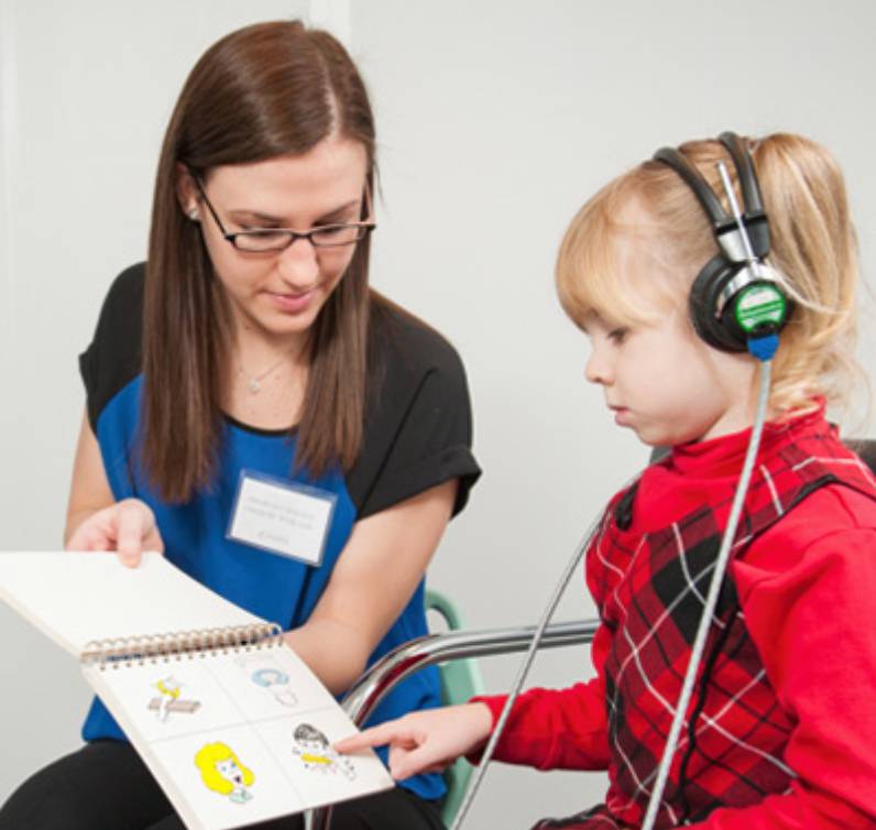 Communication Disorders Sciences student in the on campus clinic with a child