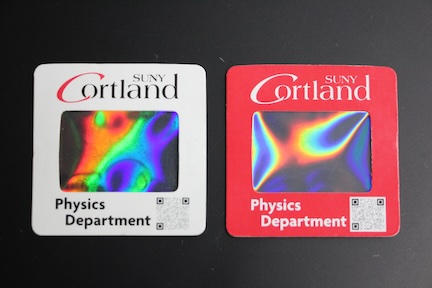side by side photo of two gratings with the SUNY Cortland logo, one with a white border and one with a red border