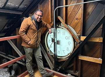 Chad Sopp installing the clock from Brockway's attic.