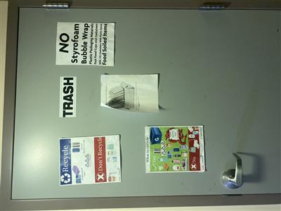 Door of trash room in Higgins Hall