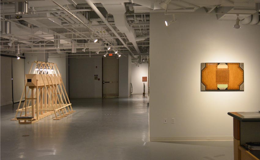 View into the central gallery at Dowd Gallery featuring sculptural objects produced by Buffalo-based sculptor Gary Sczerbaniewicz.   