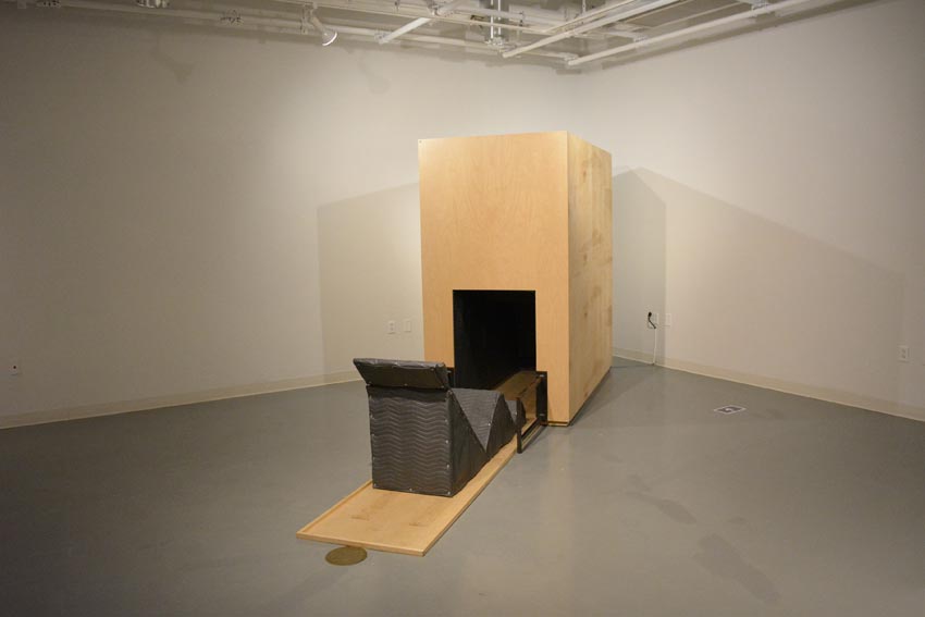 View into the west gallery at Dowd Gallery featuring sculptural objects produced by Buffalo-based sculptor Gary Sczerbaniewicz.