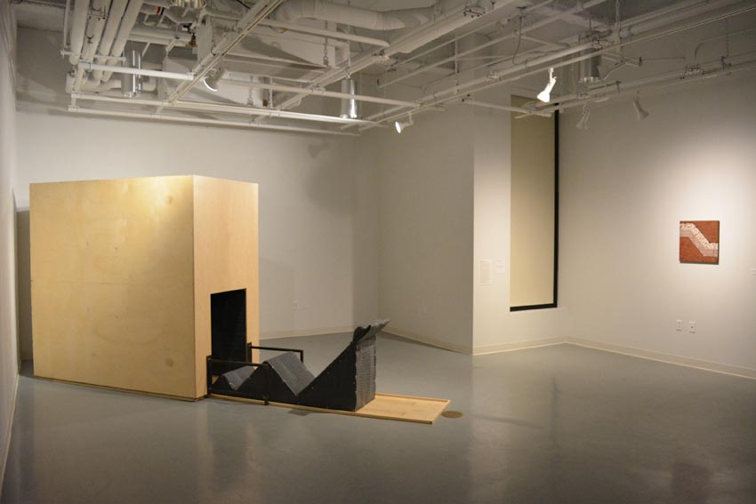 View into the west gallery at Dowd Gallery featuring sculptural objects produced by Buffalo-based sculptor Gary Sczerbaniewicz.   