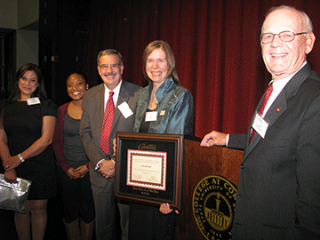 Simrell accepts award