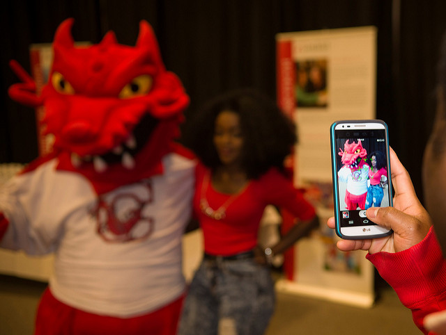 student with Blaze at Spring Open House